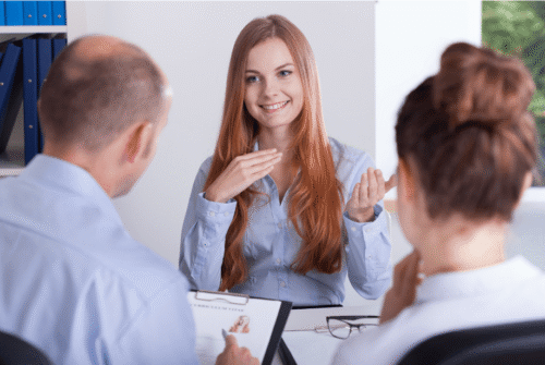 job interview woman explaining to two others
