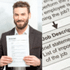The Field Engineer Resume review service image, with a candidate holding up a copy of his resume checked for application